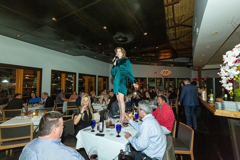 Wendy Dawson gets on a table top to toast Ibiza's 19 years of success.  (Photo by Tony Ruppe)