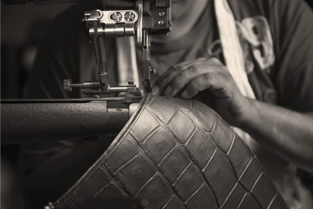 Through large windows, visitors can view the staff of 25 artisans handcraft each bag from a variety of fabrications. (Photo courtesy of Hayward)