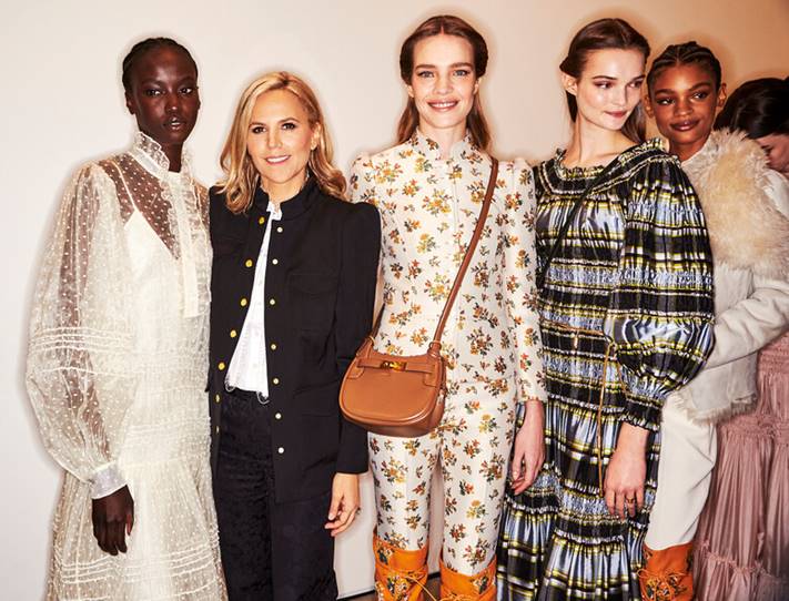 Backstage, Tory Burch poses with several models in looks from her fall runway collection. (Courtesy of Tory Burch)