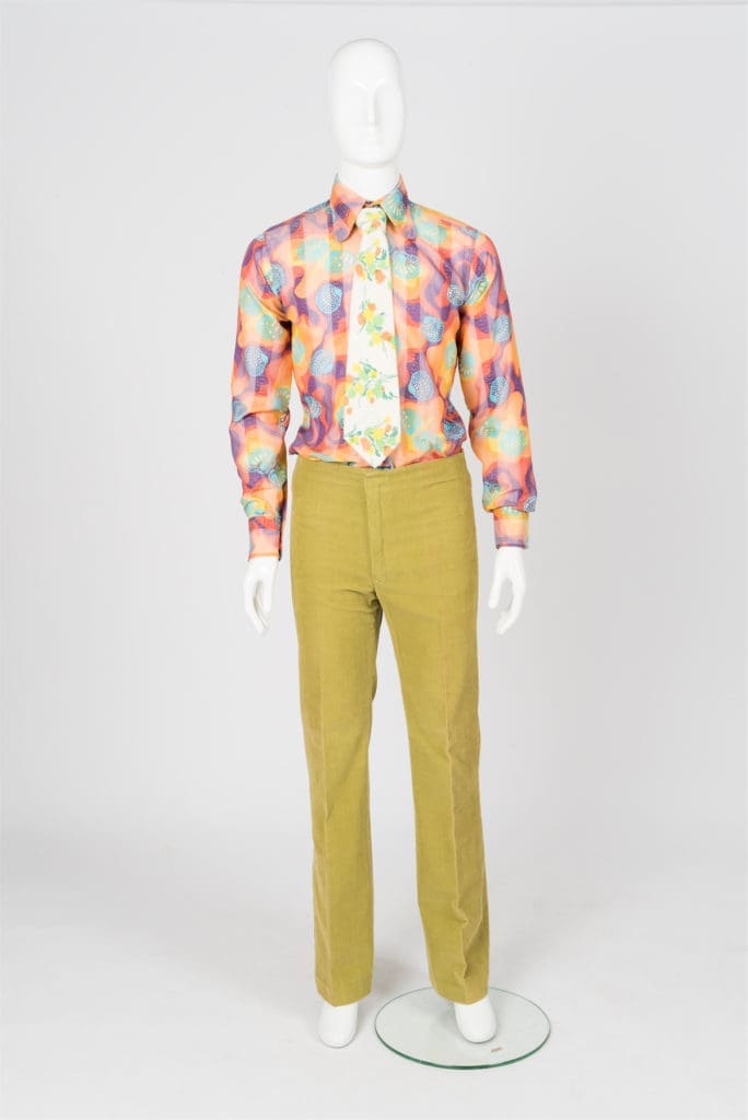 A linen tie, corduroy pants, and an Irish cotton t-shirt from the late 1960s by British designer John Stephens, who helped jumpstart what became known as the "Peacock Revolution" in London.  Stephens' Carnaby Street store was popular with iconic bands such as The Who and The Rolling Stones. 
