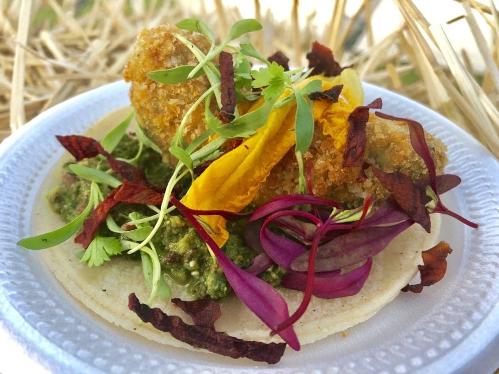 Some vendors serve up fantastical morsels like this fried squash blossom. (Photo by Courtney Dabney).
