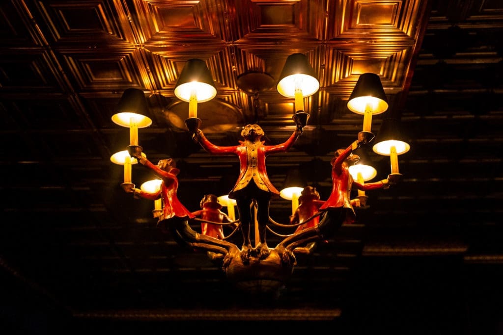 The monkey chandelier in the cozy bar (Photo by Kirsten Gilliam) 
