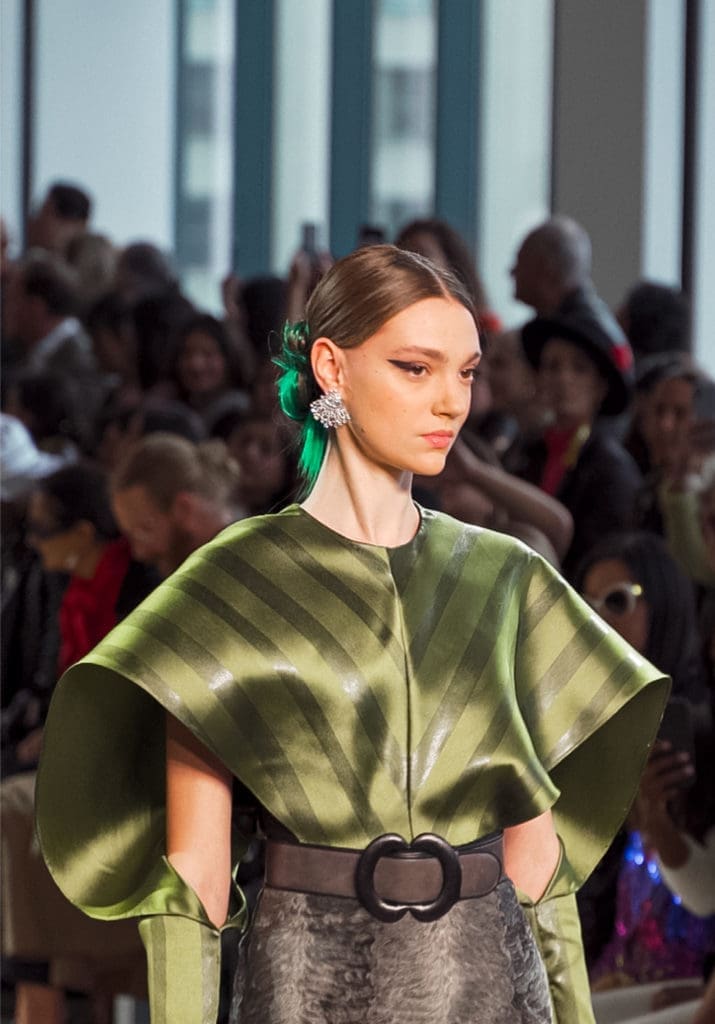 Bibhu Mohapatra henna striped silk winged top with smoke broadtail embroidered skirt. (Photo by Anna Vivare)