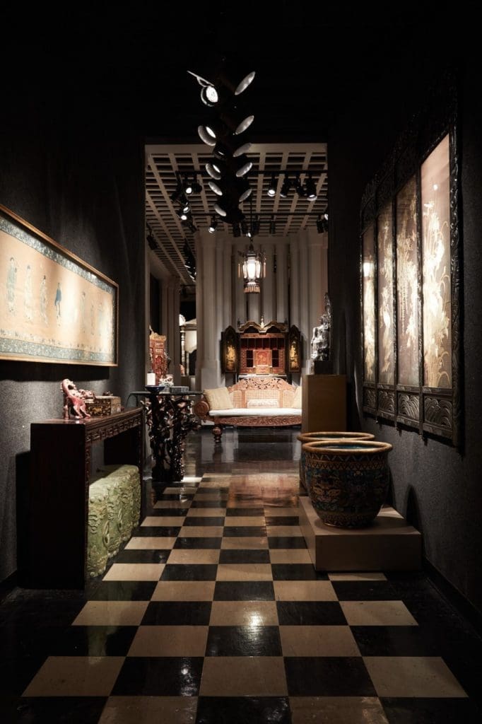 The nondescript warehouse that houses Lloyd-Paxton showroom contains a world of drama, rare and lavish antiques, with vintage theater spotlights (Photo by Pär Bengtsson)