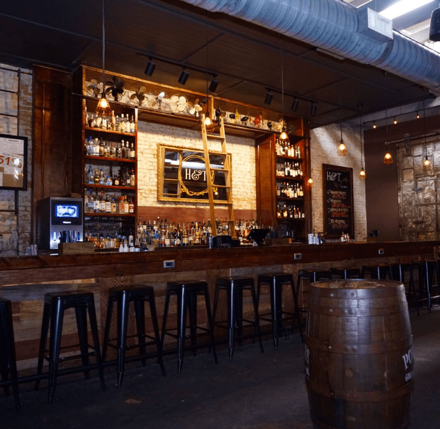 Head to the back of High & Tight Barbershop for speakeasy bar vibes.