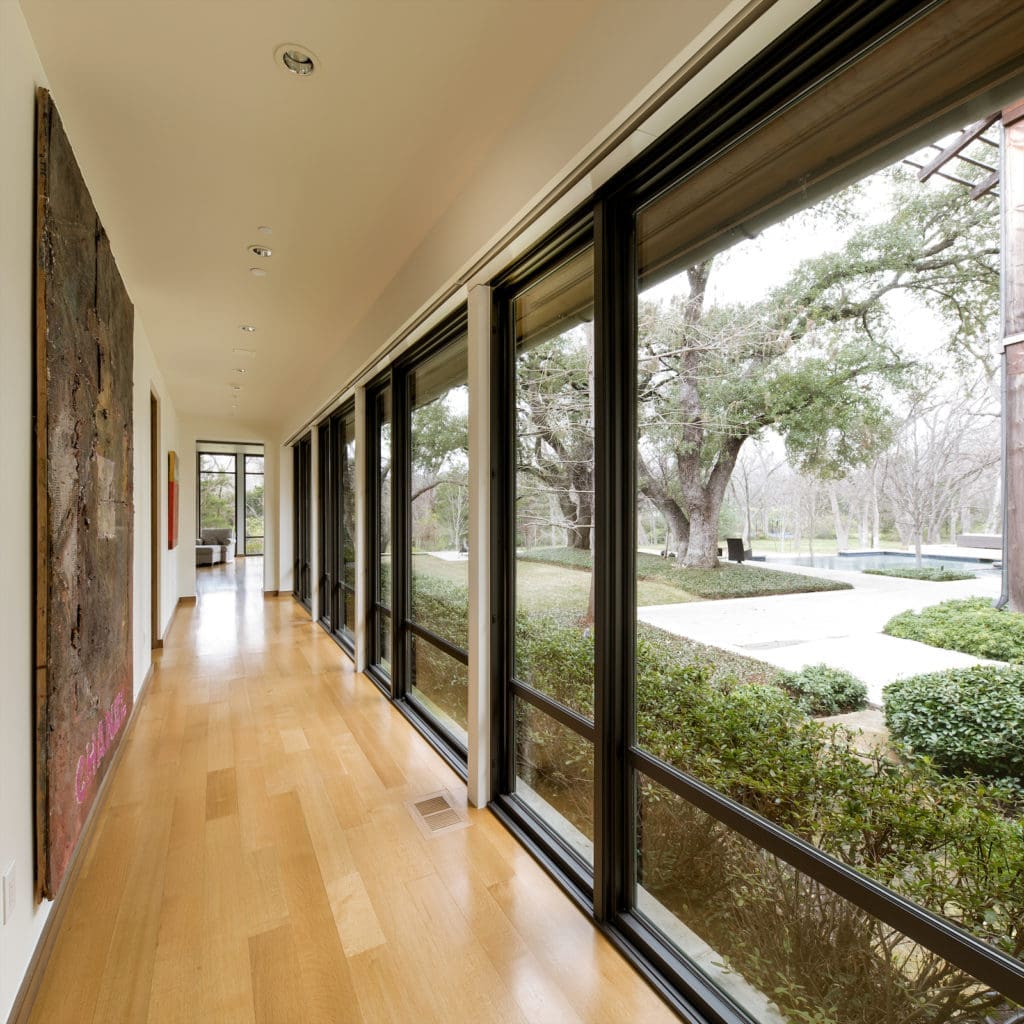 The contemporary gated estate features a rare sprawling Dallas lot with stunning architecture by Mark Hoesterey of SHM Architects.