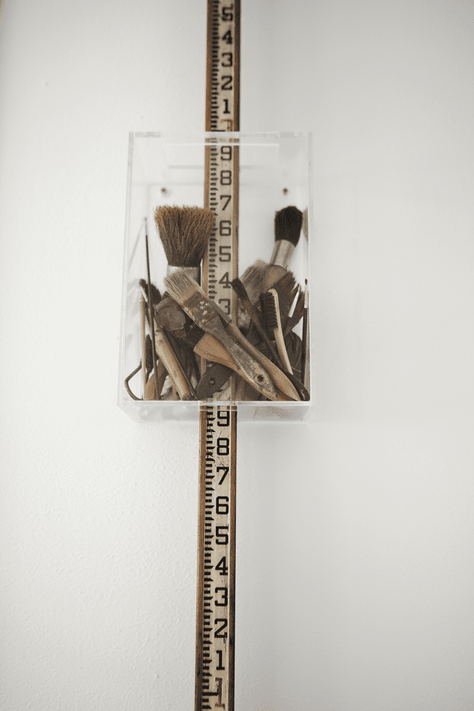 Claire Cusack, published September 2014. Photographed by Jenny Antill Clifton. In artist Claire Cusacks’ 1917 bungalow, the artist’s assemblage, "Paint by Numbers," 2013.