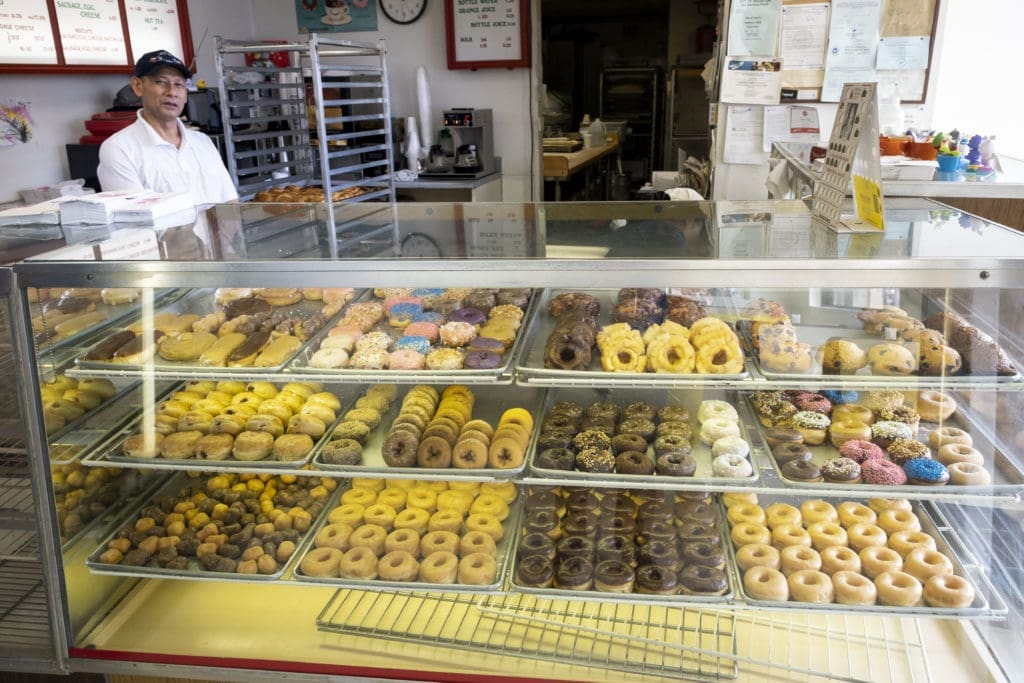 Sales are way off and supply orders curtailed at Bakery Donut, a mom-and-pop-owned shop whose inventory of donuts isn't moving like it used to. (Photo by F. Carter Smith)