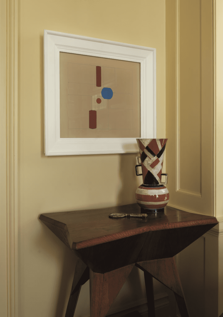 Mary Cullen and the late Roy Cullen, published January 2012. Interior design Michael J. Siller. Photographed by Jack Thompson. In Mary Cullen and the late Roy Cullen’s River Oaks home with its prized collection of Czech avant-garde art is a vignette in the library with a rare Cubist table by Vlastislav Hofman, 1912; a 1929 ceramic vase by Austrian talent Gudrun Baudisch; and a gouache on cardboard by Brazilian Helio Oiticica, "Seco #15," 1956.

