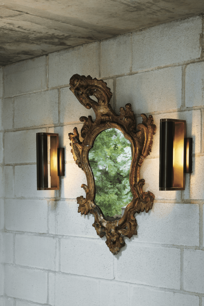 David Griffin and James Ferrara, published July/August 2017. Architectural design James Ferrara. Interior design Jennifer Haralson. Photographed by Lisa Petrole. David Griffin and James Ferrara’s modernist villa in Oak Cliff’s Kessler Woods was inspired by Italy and 16th-century architecture. In the vestibule, late-18th-century Venetian mirror from James Powell Antiques, Austin.
