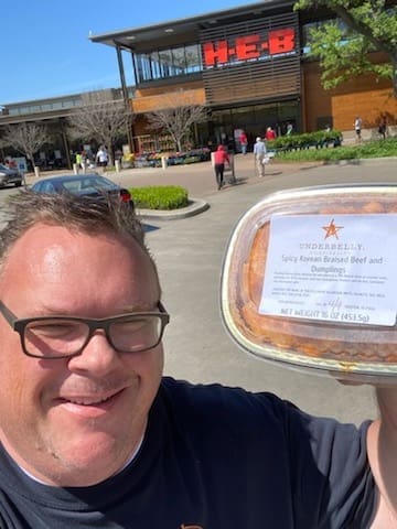 Underbelly Hospitality chef/owner Chris Shepherd proudly displays his restaurant offerings now being sold at H-E-B's across the city. (Courtesy photo)