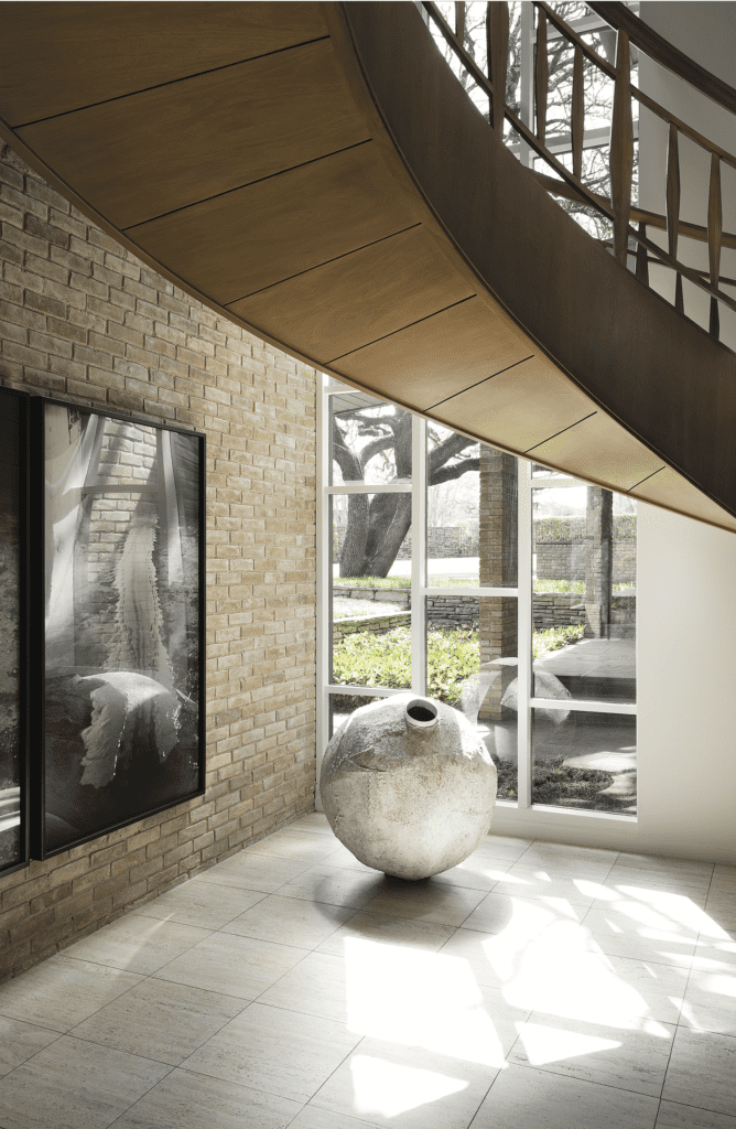 Sharon and Michael Young, published March 2017. Interior Design and Architectural Renovation Bodrun + Fruit. Photographed by Lisa Petrole. In art collectors Sharon and Michael Young’s 1961-era home in Dallas’s Preston Hollow, the magnolia-wood floating staircase is original to the house. Miroslaw Balka’s "Untitled," 2001. Hanging, Paul McCarthy’s "White Line Painted on the Floor with my Face," 1972. 