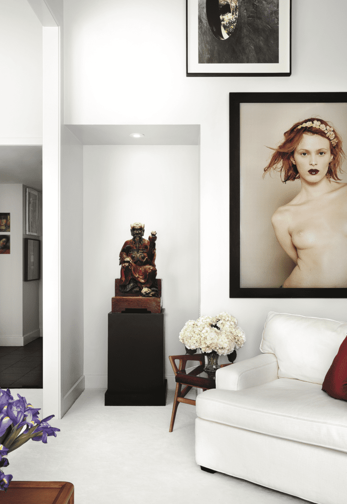 Mark Fehrs Haukohl, published November 2017. Photographed by Lisa Petrole. In Mark Fehrs Haukohl’s Houston high-rise, an antique temple figure acquired in Vietnam, photograph of Karen Elson by French photographer Bettina Rheims, Gio Ponti stool.