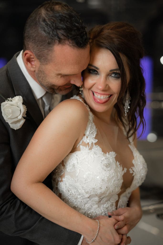 Mr. and Mrs. Clark Carroll share a loving moment on their wedding day at The Post Oak Hotel.  (Photo by Daniel Pawlowski, (www.theweddingshow.biz))