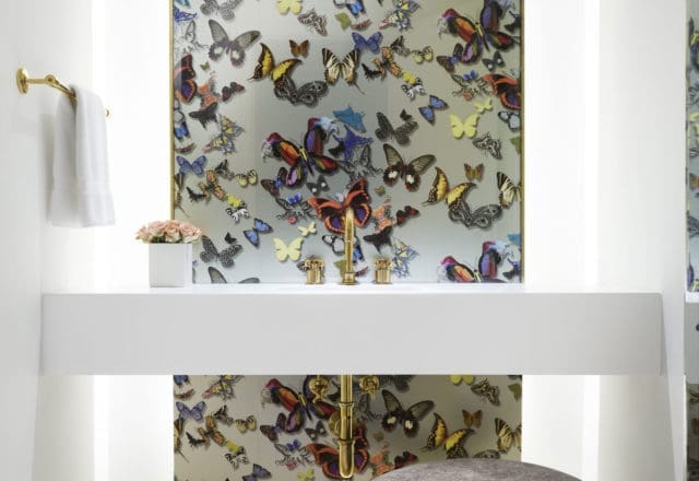Christian Lacroix "Butterfly Parade" wallpaper takes center stage in the powder room of Maxine Trowbridge's spa-like Dallas retreat. (photo by Lisa Petrole)  