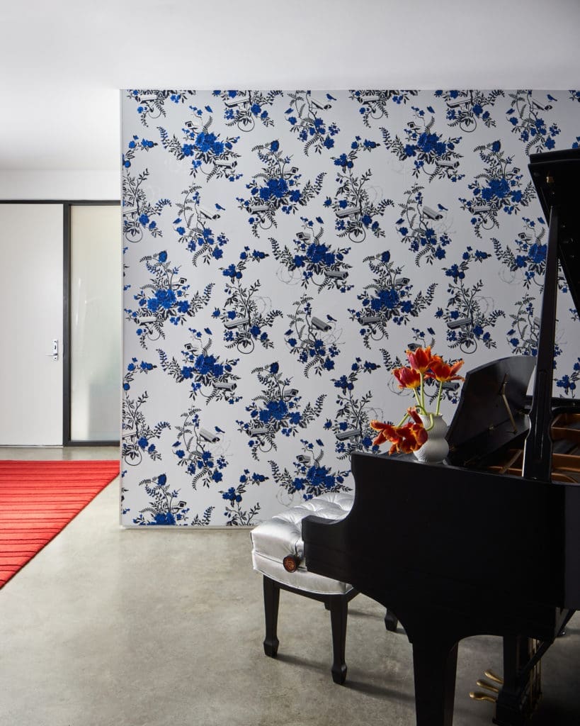 Wallpaper by Flavor Paper. Stool is upholstered in shagreen-embossed platinum leather by Garrett Leather from EC Dicken. (Photo by Stephen Karlisch)