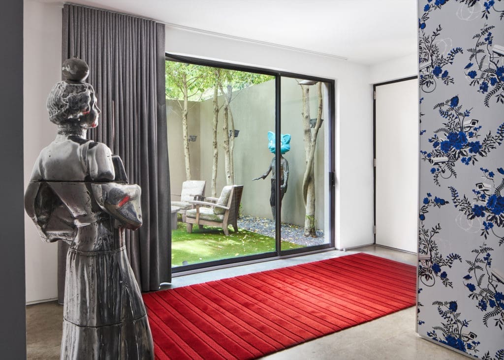 Sculptures in a luminous Knox-Henderson townhouse's courtyard and entry are by Elliot Eames Saarinen. (Photo by Stephen Karlisch)