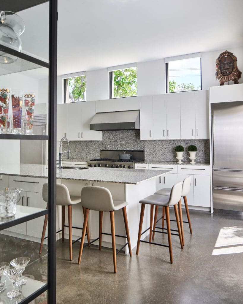 Granite was a cutting-edge material 20 years ago, and although it’s now considered dated, the homeowner has no plans to replace it. “I wanted to embrace the house just the way it is.” (Photo by Stephen Karlisch)