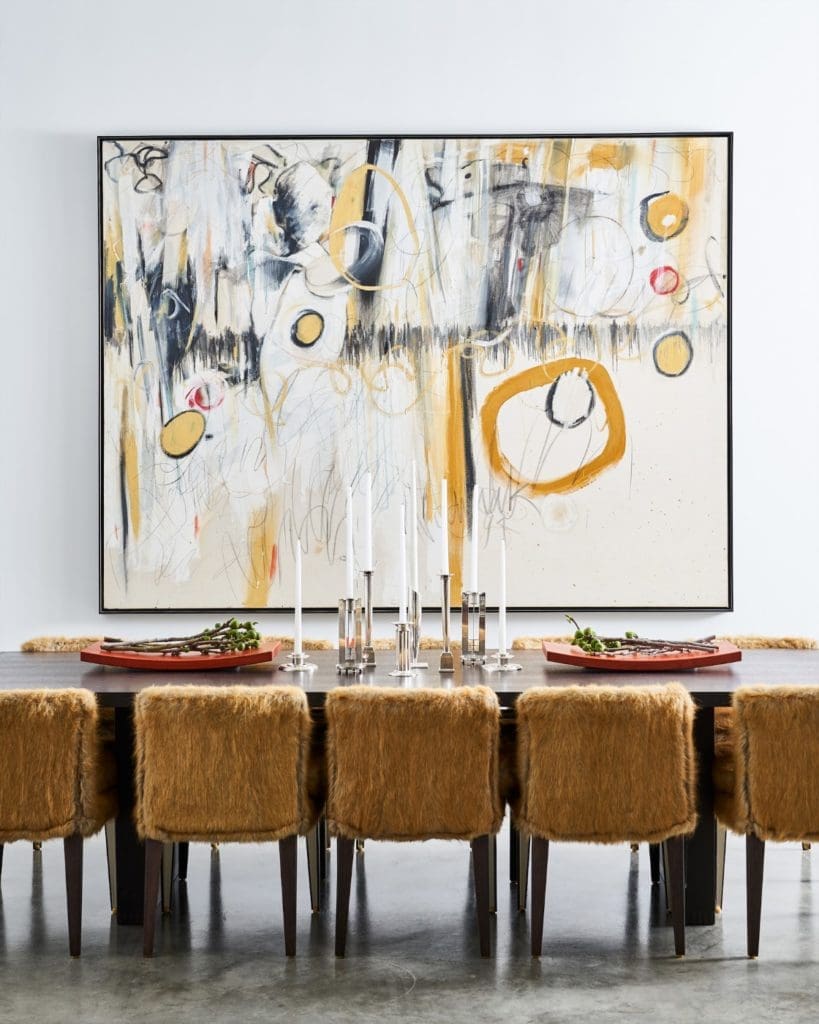 On the second level, the dining-room table and chairs are B&B Italia. 
Collection of sterling candlesticks, curated by
Russell Brightwell, includes designs by Richard Meier. (Photo by Stephen Karlisch)