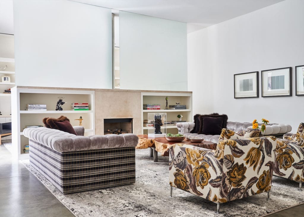 In the second-level living area, sofas from A. Rudin are customized with Romo plaid velvet. B&B Italia chairs covered in Paul Smith fabric by Maharam. Stark rug. (Photo by Stephen Karlisch)