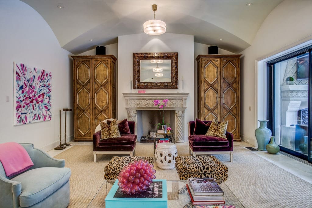 An inviting family room features a full retractable wall of windows. (Photo by Compass Real Estate)