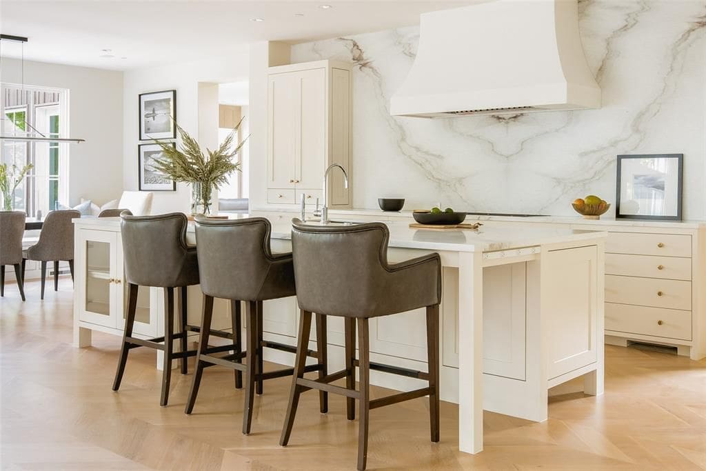 A white marble filled kitchen.  (Photo by Compass Real Estate)