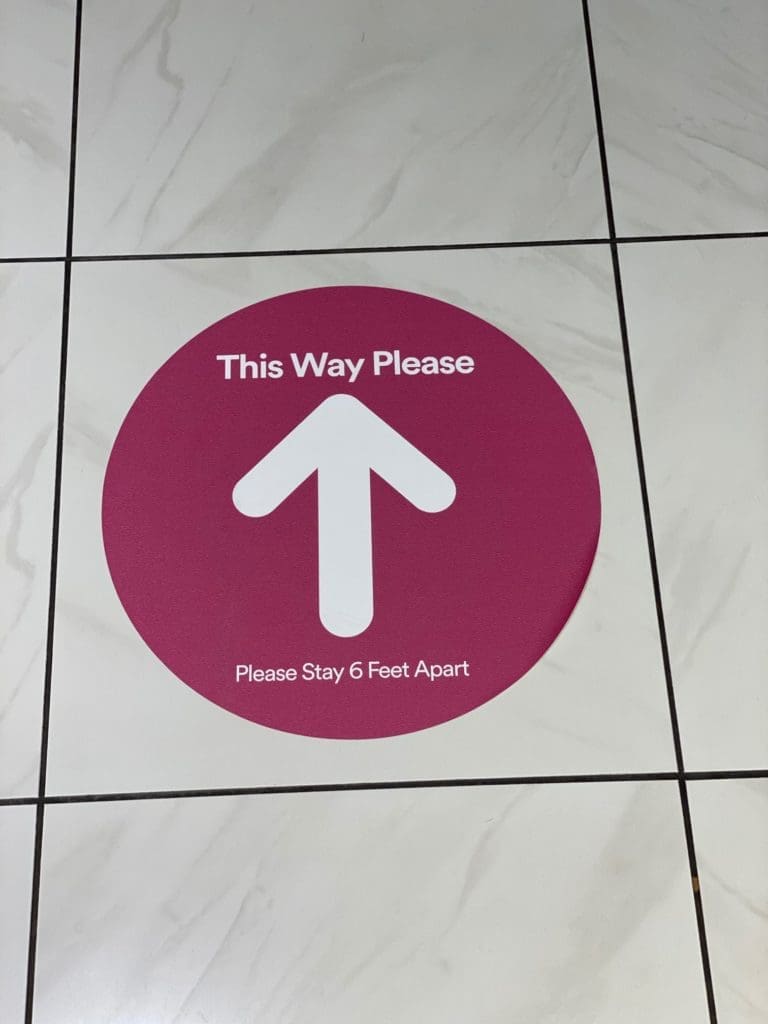 Signs throughout The Galleria direct foot traffic in one-way patterns in order to maintain social distancing. (Photo by Shelby Hodge)