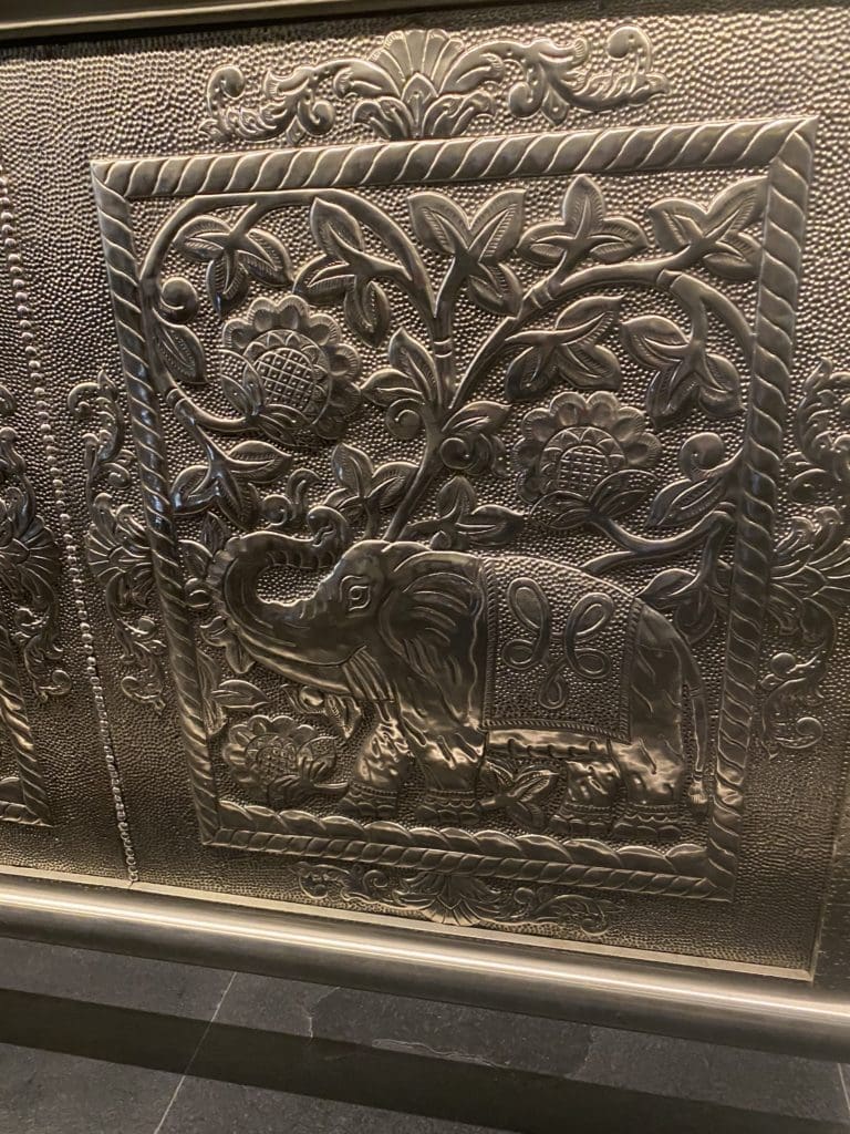 Musaafer detail of tin plates at the bar