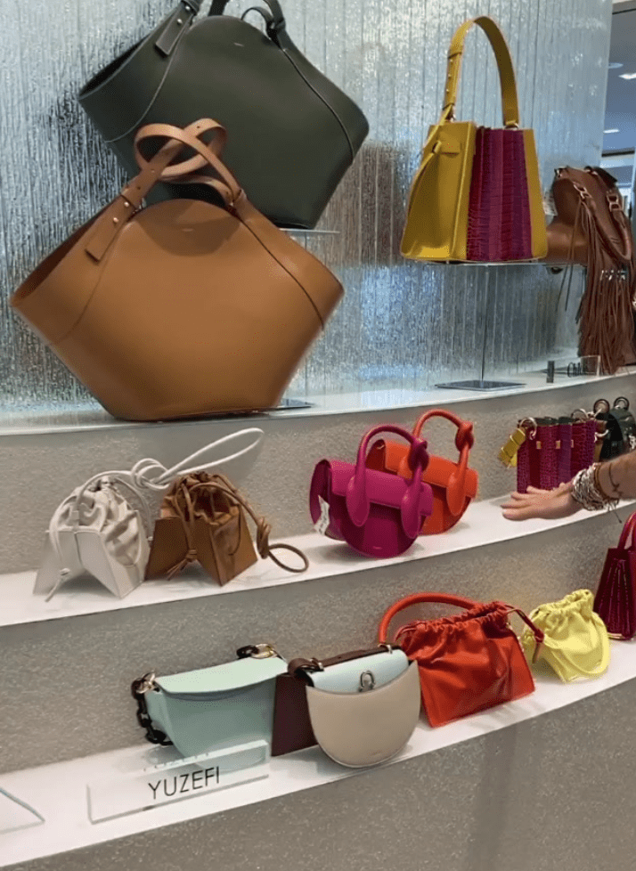 Designer handbags on display at Tootsies.