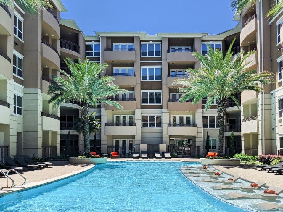 The resort-style pool and courtyard at Tuscany Walk Apartments.