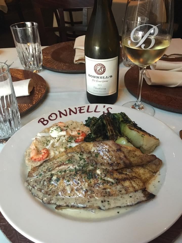 Plating at Bonnell's featuring pompano with a creole mustard and lemon beurre blanc.