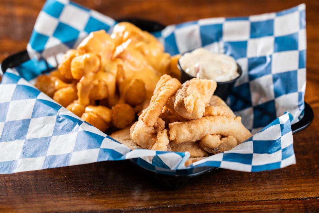 The Pimento Cheese Queso Smothered Tots at Palmer's are a must-try. (Photo by Kathy Tran)