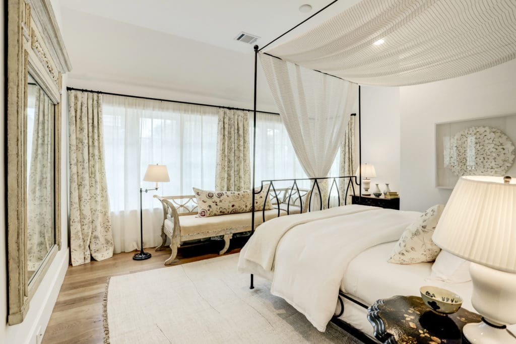 Secondary Bedroom (designed by Kathryn Ireland) with great natural light, hardwood floors, ensuite bath, and a huge walk in closet.