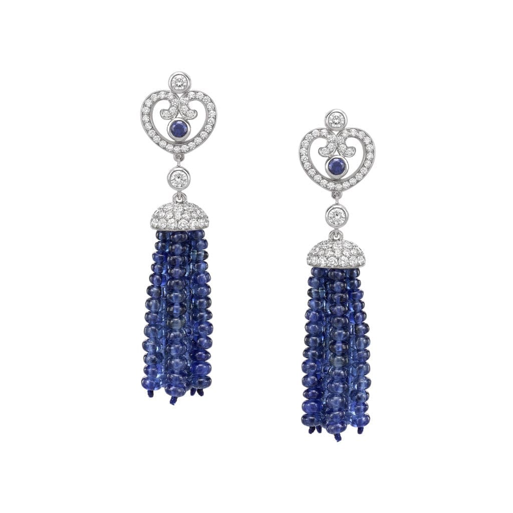 Impératrice Sapphire tassel earrings feature round sapphire center stones surrounded by white diamonds, with a tassel of sapphire beads, set in 18 karat white gold.