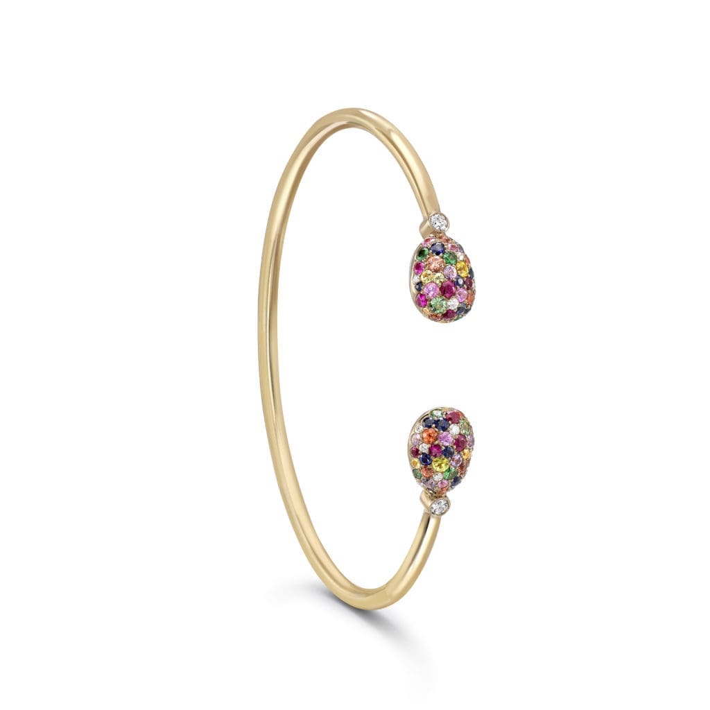 The Emotion yellow gold open bracelet features an intensely colorful collection of 50 pavé-set multi-colored stones.