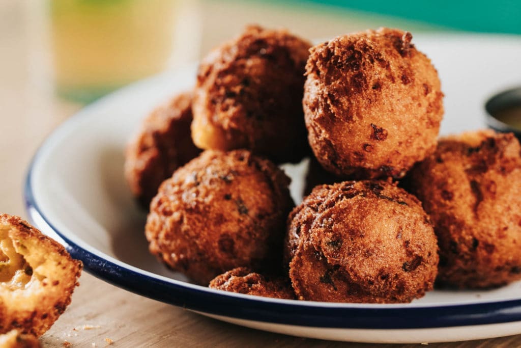 The hush puppies at JAXON come with jalapeno and cheddar cheese.