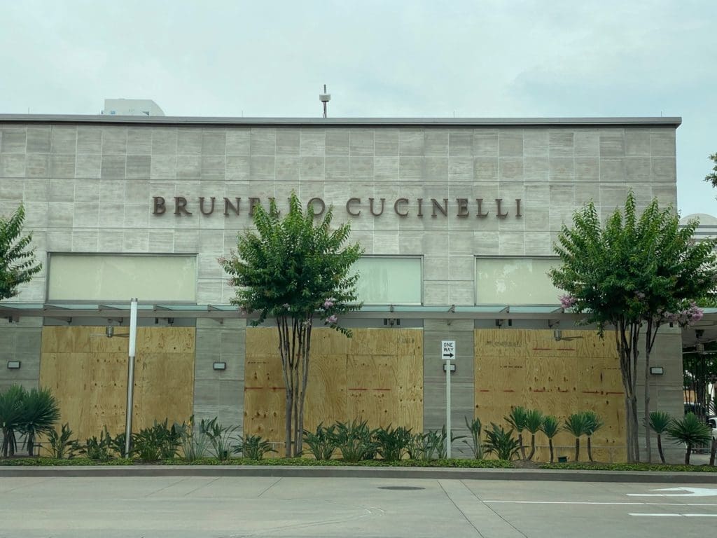 With merchandise removed from sight, Brunello Cucinelli in River Oaks District boards up. (Photo by Shelby Hodge)