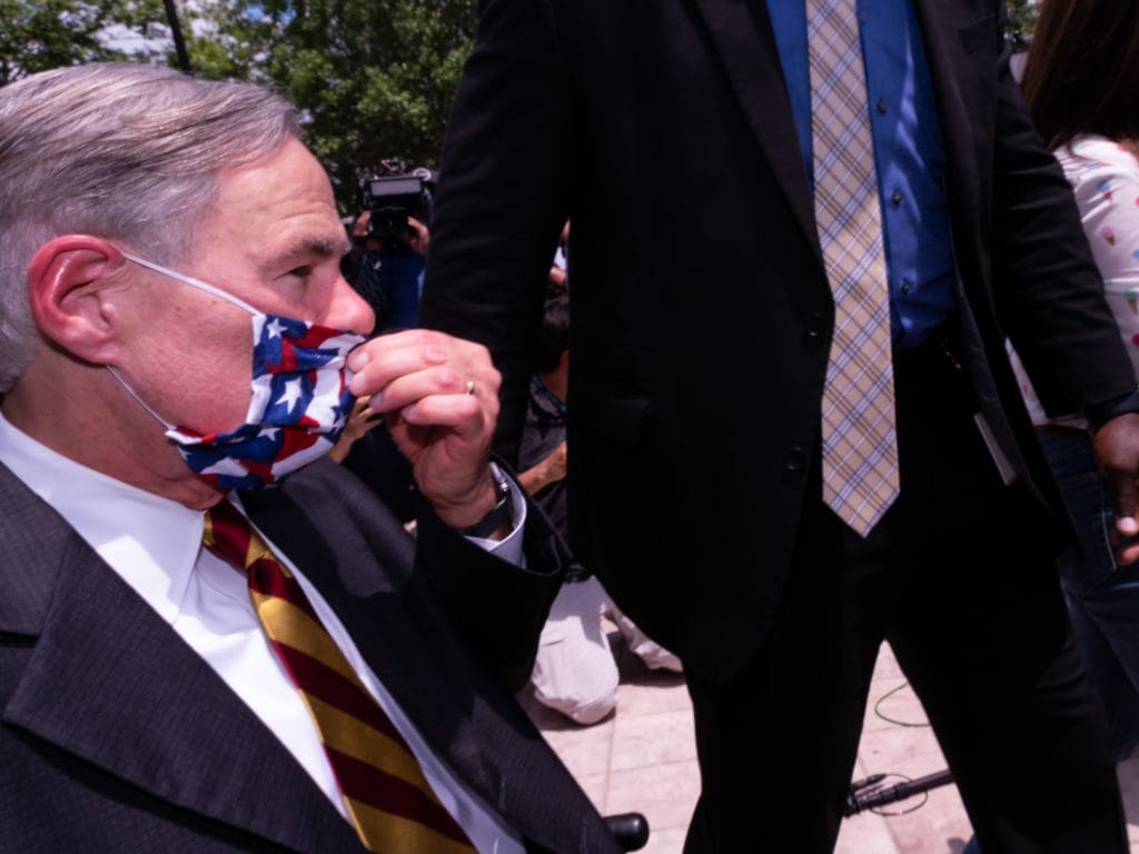 Governor Greg Abbott came out, wearing his American flag face mask, to pay tribute to George Floyd. (Photo by F. Carter Smith)
