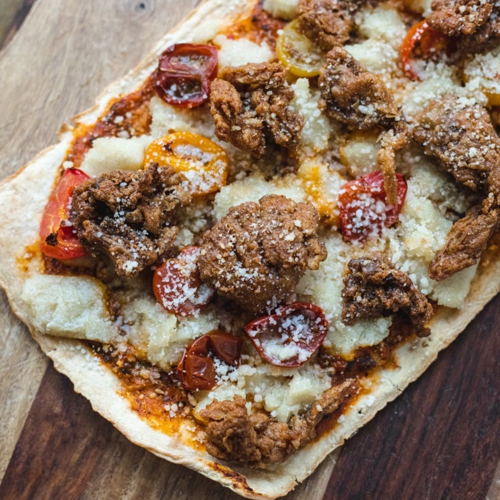 The Impossible Italian Sausage and Mushroom Pizza at TLC Vegan Kitchen is our favorite.