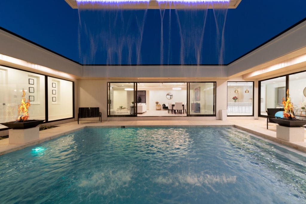 The custom water feature open to the night sky.