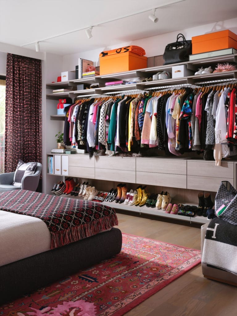 Asher’s closet displays shoes and clothing like art, including feathered and ruffled pieces by Marc Jacobs, Ashish sequined shirts, and Comme des Garçons and Hermès handbags.  (Photo by Lisa Petrole)