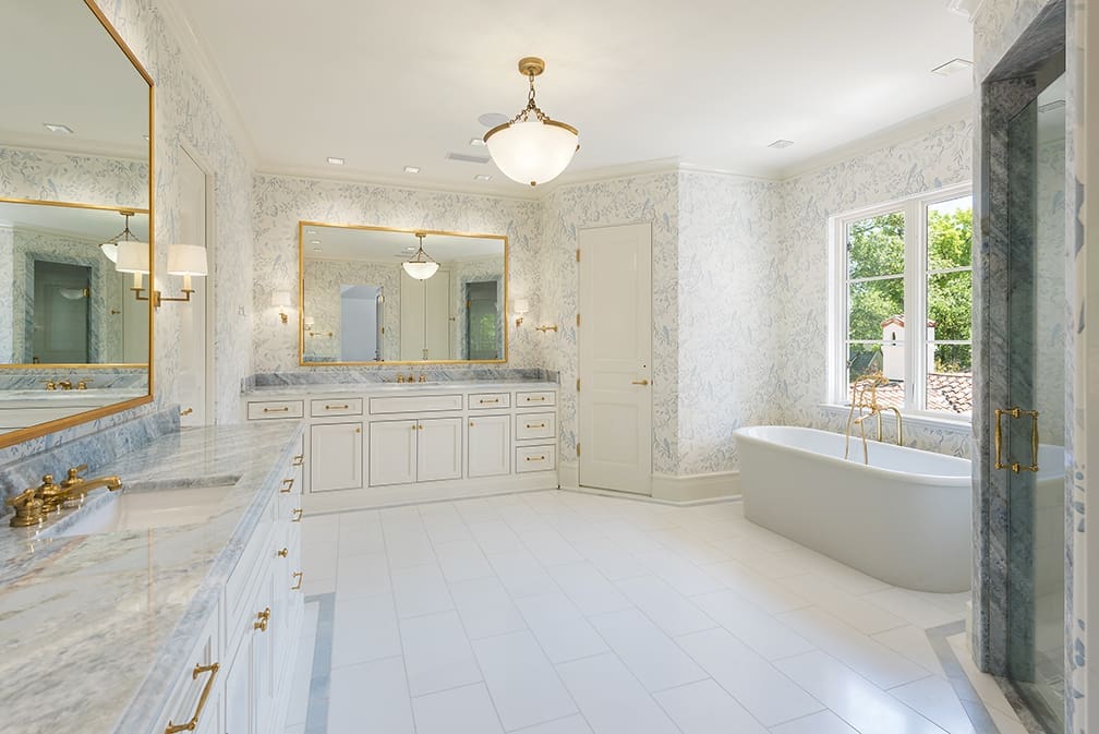 A marble and light filled master bath. (Photo by Stephen Reed)