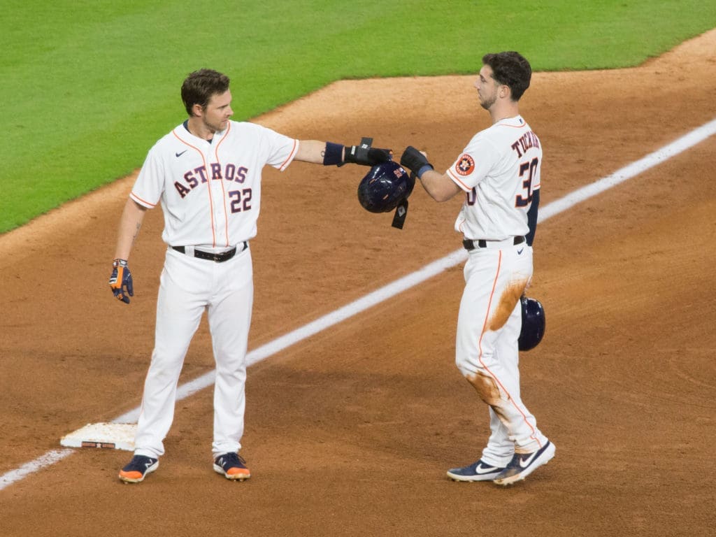 Josh Reddick and Kyle Tucker are linked by the right field battle — and each brings something different to the Astros. (Photo by F. Carter Smith)