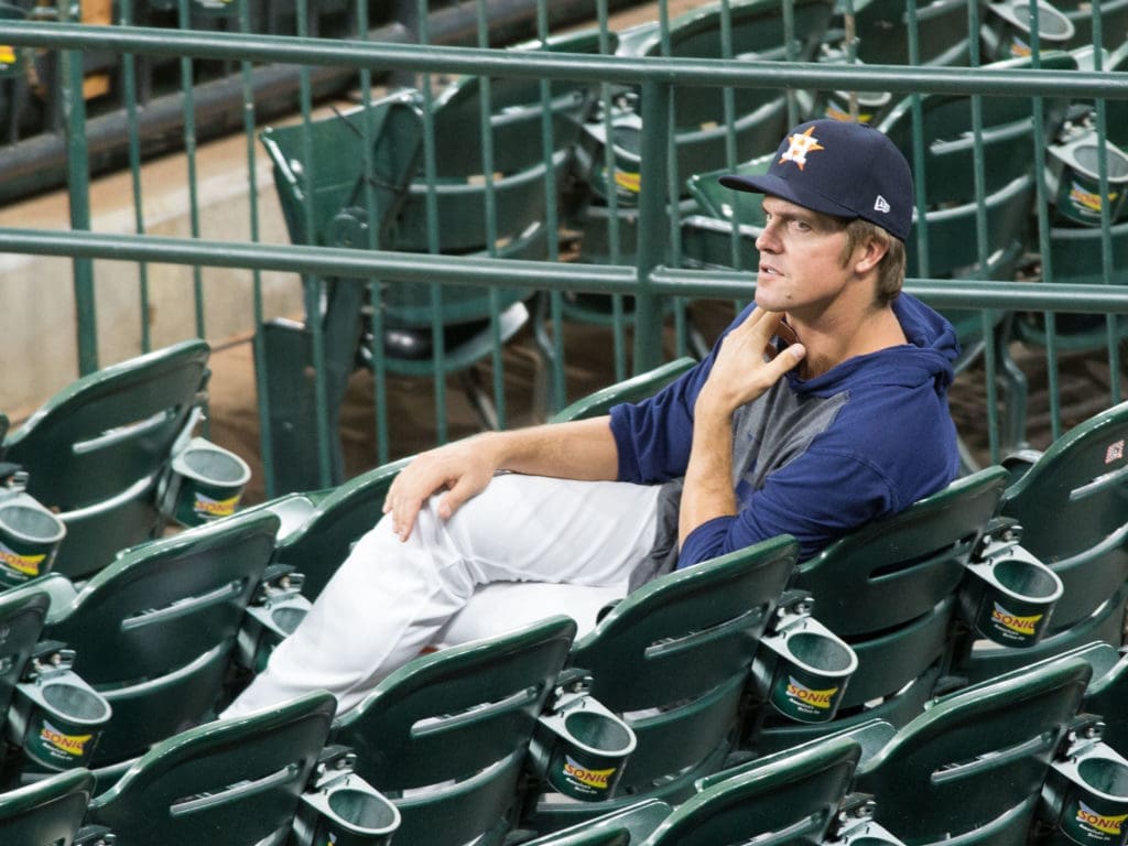 Houston Astros pitcher Zack Greinke socially distanced by sitting in the empty stands. (Photo by F. Carter Smith)