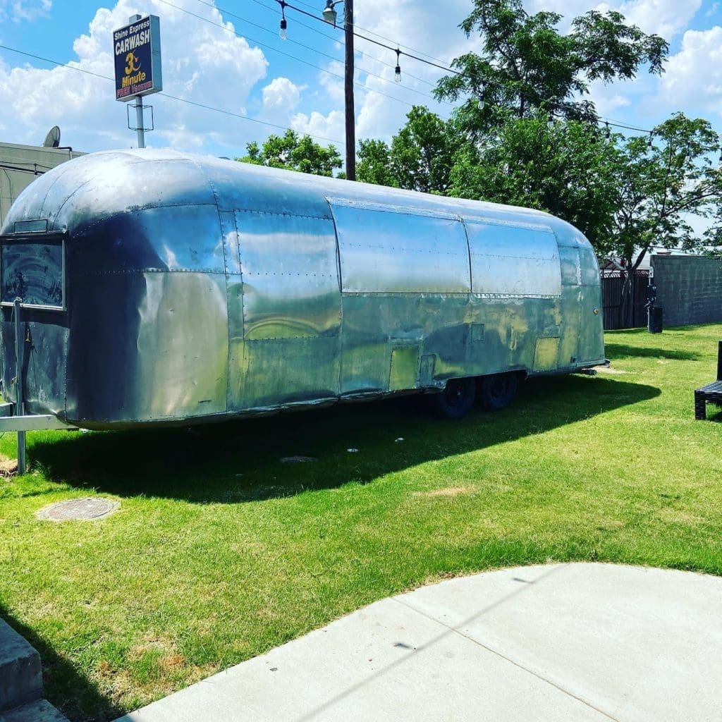 The dessert trailer Airstream on the lawn at Berry St. Ice House.