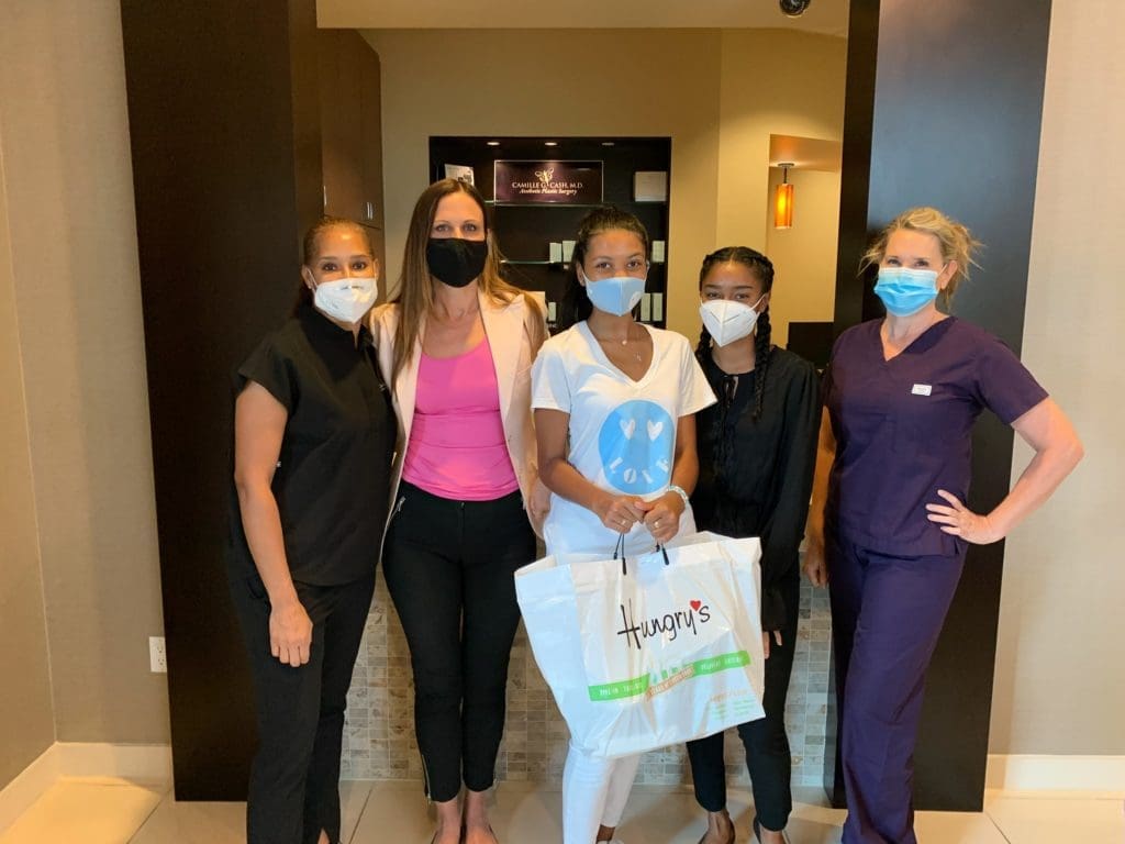 Gia brings essential workers lunch at Camille G. Cash. M.D.