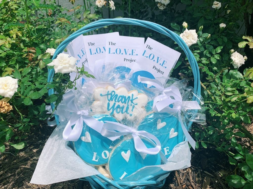 Gia’s McCrae’s care package includes cookies from a local bakery, custom brochures, and stickers