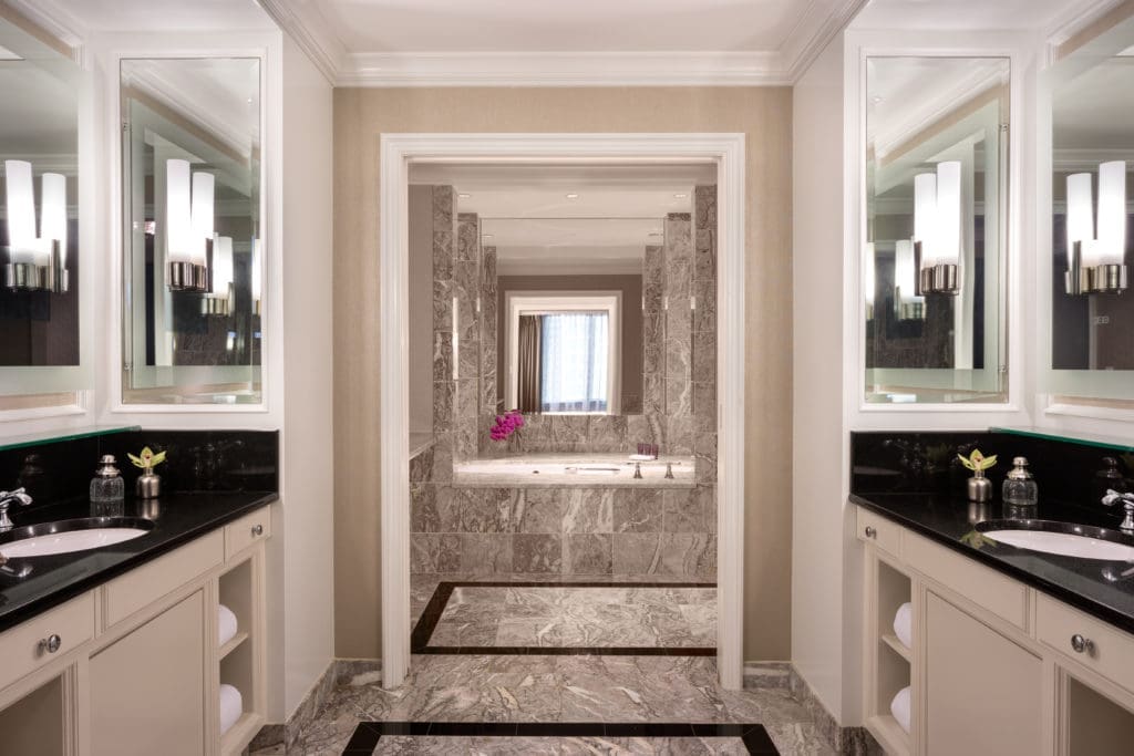 Your well-appointed bathroom equipped with a tub perfect for diving into your copy of "The Chiffon Trenches: A Memoir."