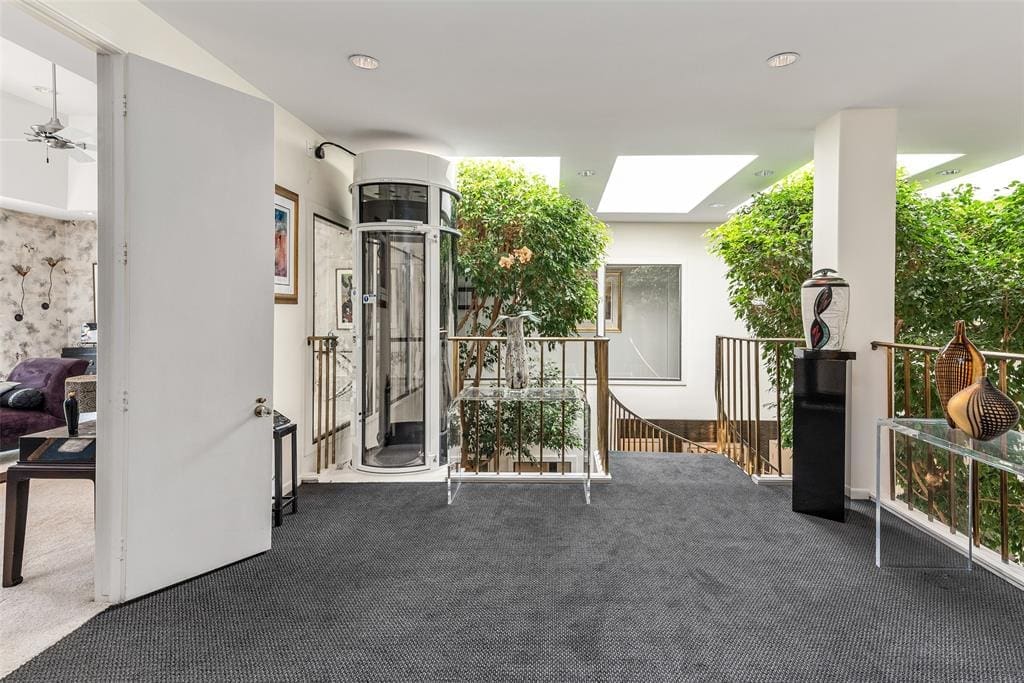 The second floor landing offers grand views down to the living/entertaining space.