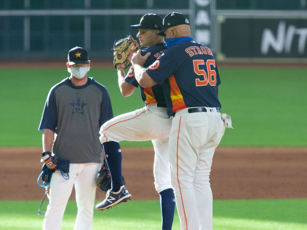 Pitching coach Brent Strom helps Brandon Bielak with his pitching mechanics. (Photo by F. Carter Smith) 